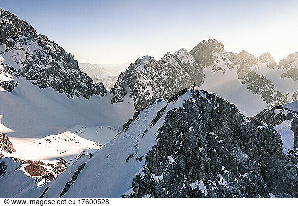 Hiker standing on snow covered mountain in winter vacation  Vorderer Tajakopf  Ehrwald  Tirol  Austria