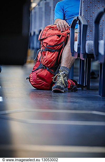 Hiker with rucksack in train
