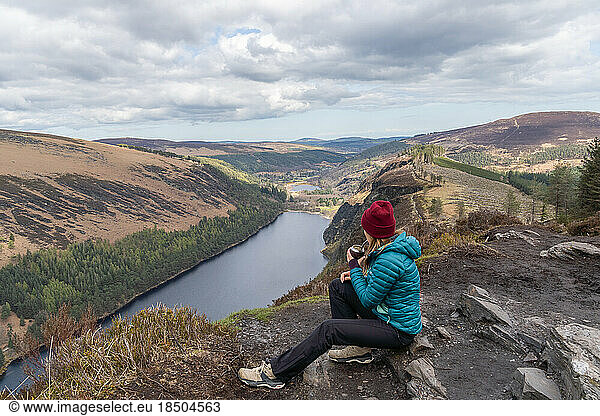 Hiker woman drinking traditional Argentinian mate in Glendalough