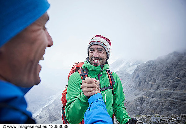 Hikers congratulating themselves  Mont Cervin  Matterhorn  Valais  Switzerland