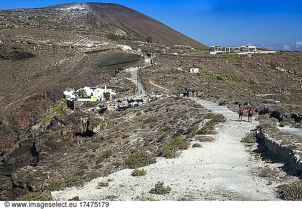 Hikers hike along the crater hiking trail  Santorini  Cyclades  Greece  Europe