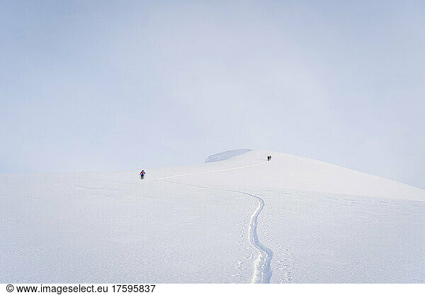 Hikers hiking on snowcapped mountain at Sheregesh  Russia