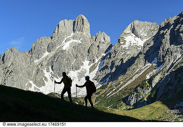 Hikers with poles hiking on mountain  Rinderfeld  Salzburg  Austria
