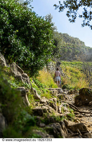 Hiking along sunny amalfi coast in Italy