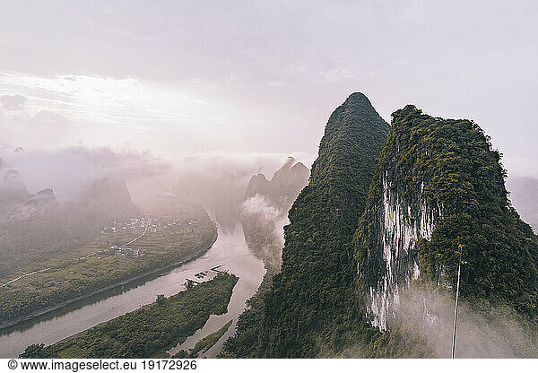Hills under cloudy sky at sunrise  Xingping Town  Guilin  China