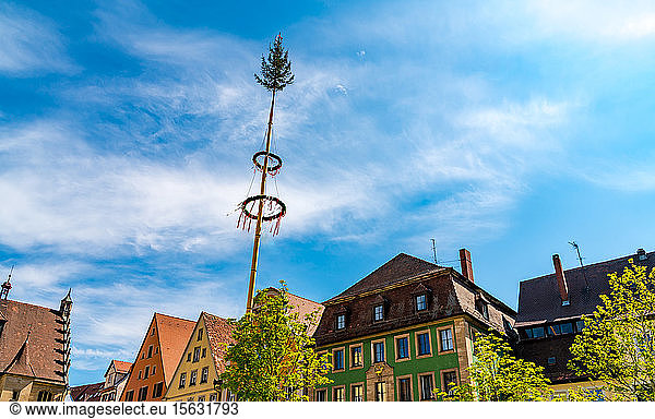 Historic architecture with traditional maypole in Weissenburg  Bavaria  Germany