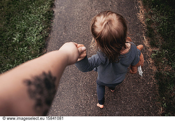 holding hands and walking down the street