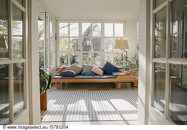 Home interior with large windows