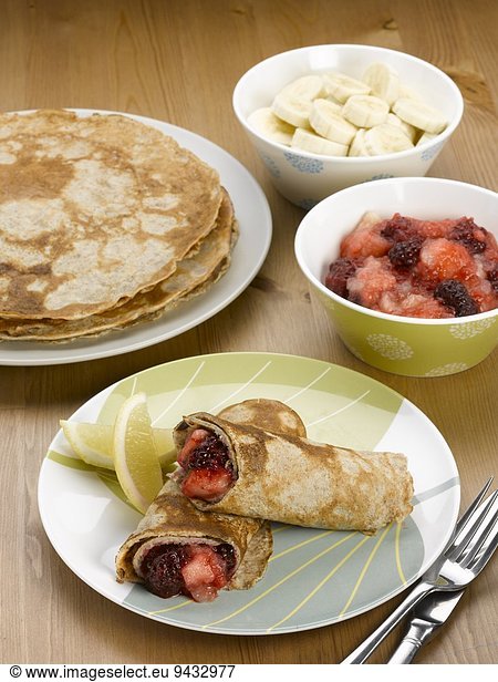 Homemade pancakes filled with stewed fruit