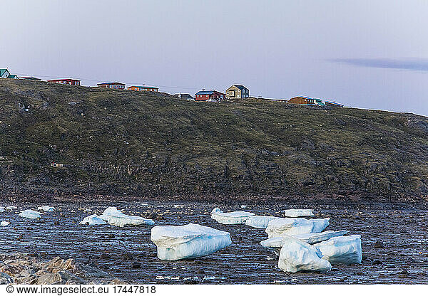 Homes built on cliff above the shoreline  city of iqaluit  Canada.