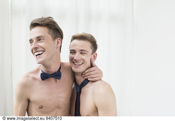 Homosexual couple caress each other  smiling