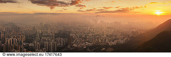 Hong Kong cityscape lit up at dawn.
