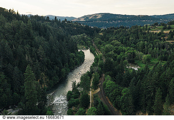 Hood River winds its way through forests to the Columbia River in OR.