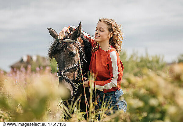 Horse and young woman getting away from it all.
