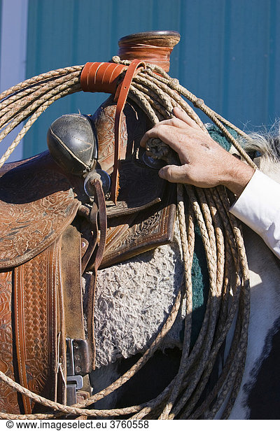 Horse saddle and cowboy hand  wildwest  Oregon  USA