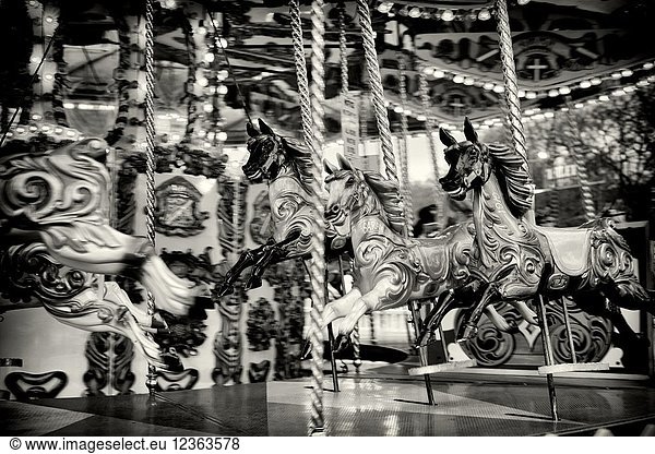Horses on a fairground carousel at Winter Wonderland in Hyde Park. Hyde Park  London  England.