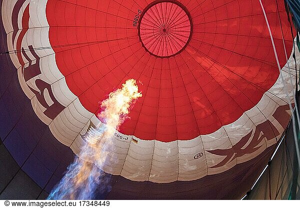 Hot air balloon  balloon flight  view into the balloon envelope during heating up  Germany