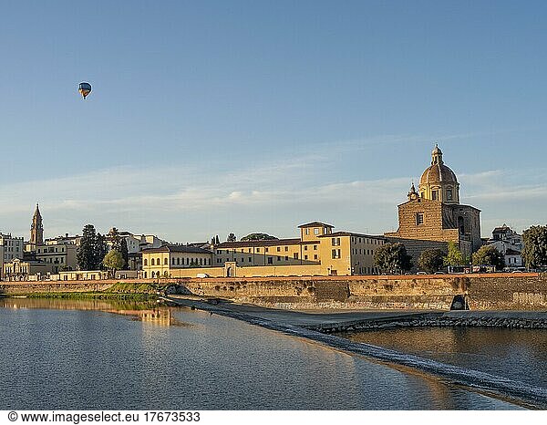 Hot air balloon flying over the Basilica di Santa Maria del Carmine on the river Arno  Florence  Tuscany  Italy  Europe