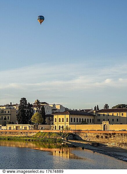 Hot air balloon flying over the river Arno  Florence  Tuscany  Italy  Europe