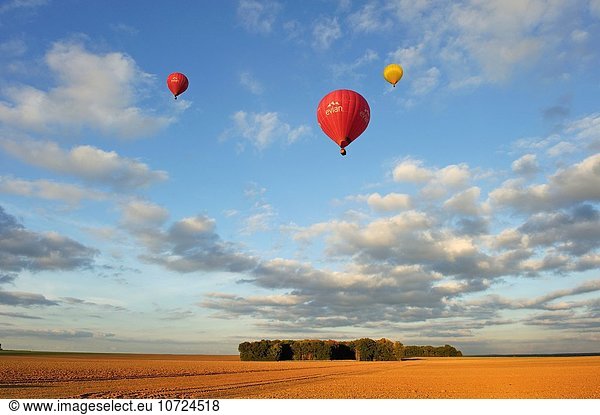 Hot air balloon in flight over the fields in Beauce region  Eure-et-Loire department  Centre region  France  Europe.