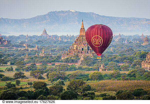 Hot air balloon in the air above the plain of temples in Mandalay