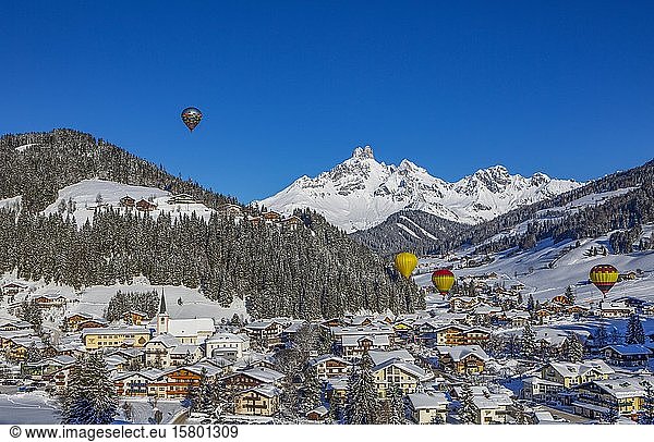 Hot air balloons  Filzmoos in winter with mountain peak Bischofsmütze  Pongau  Province of Salzburg  Austria  Europe