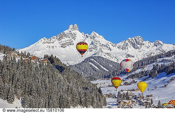Hot air balloons  Filzmoos in winter with mountain peak Bischofsmütze  Pongau  Province of Salzburg  Austria  Europe