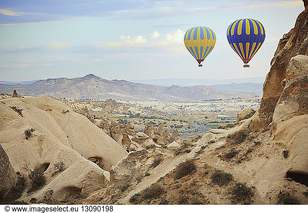 Hot air balloons flying over Cappadocia