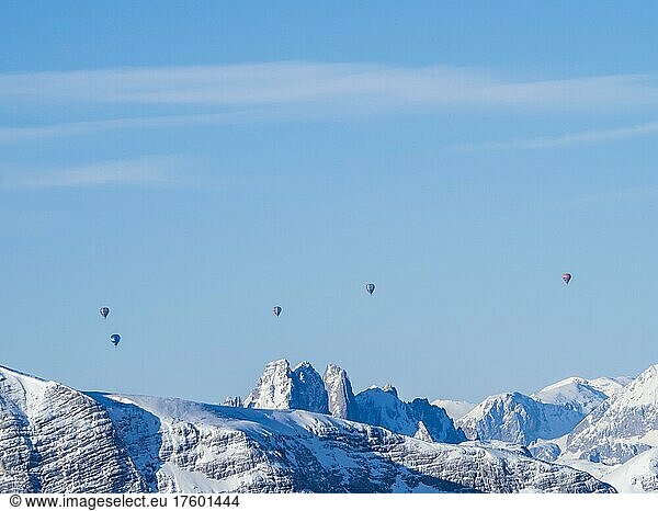 Hot air balloons flying over snow-covered Alpine peaks  view from Krippenstein  Salzkammergut  Upper Austria  Austria  Europe