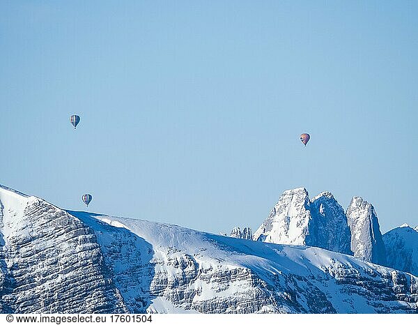 Hot air balloons flying over snow-covered Alpine peaks  view from Krippenstein  Salzkammergut  Upper Austria  Austria  Europe