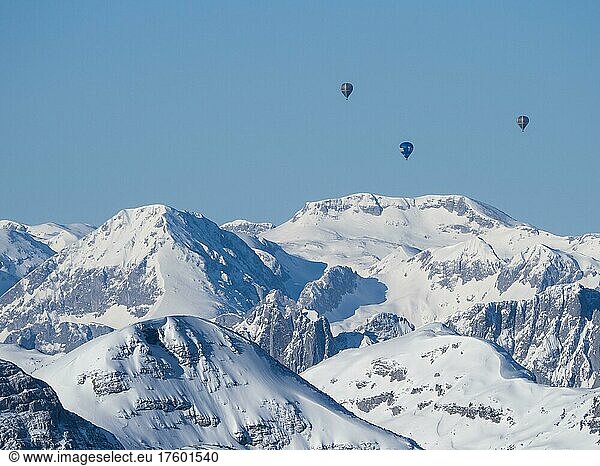 Hot air balloons flying over snow-covered Alpine peaks  view from Krippenstein  Salzkammergut  Upper Austria  Austria  Europe