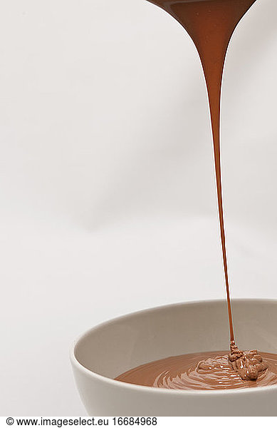 hot chocolate pouring into bowl