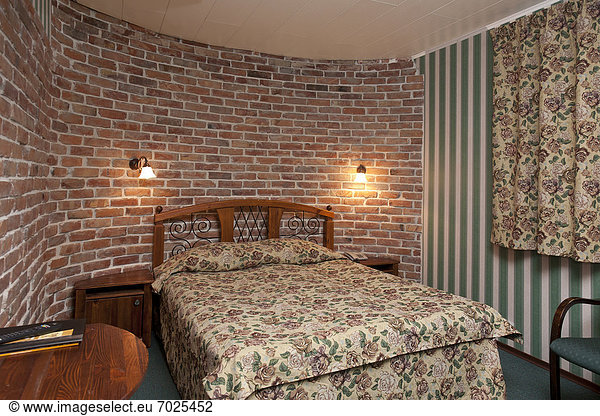 Hotel Bedroom Interior With Brick Walls