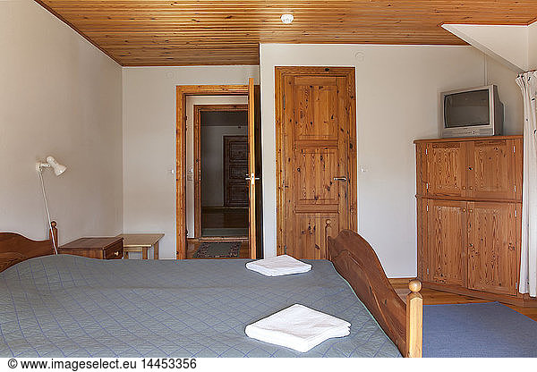 Hotel Bedroom With Wood Ceilings