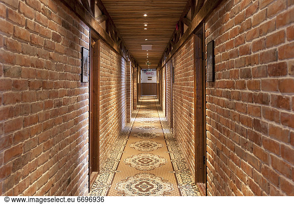Hotel Hallway With Brick Walls