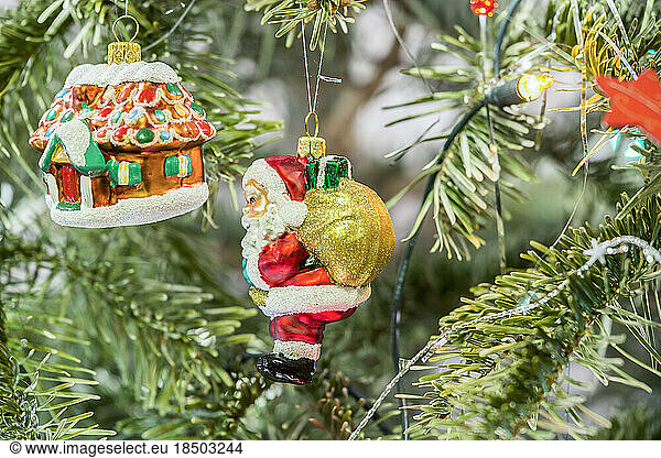 House and Santa Claus hanging on Christmas tree  Munich  Germany