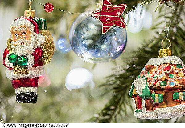 House and Santa Claus hanging on Christmas tree  Munich  Germany