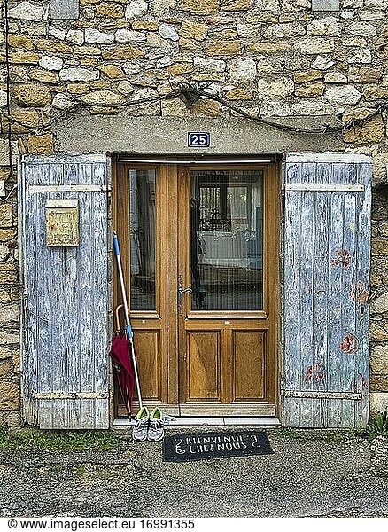 House door with mop and shoes and blue shutters  Condat  Lot-et-Garonne Department  Nouvelle-Aquitaine  France.