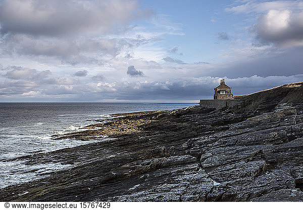 House overlooking rocky seascape Howick Northumberland UK