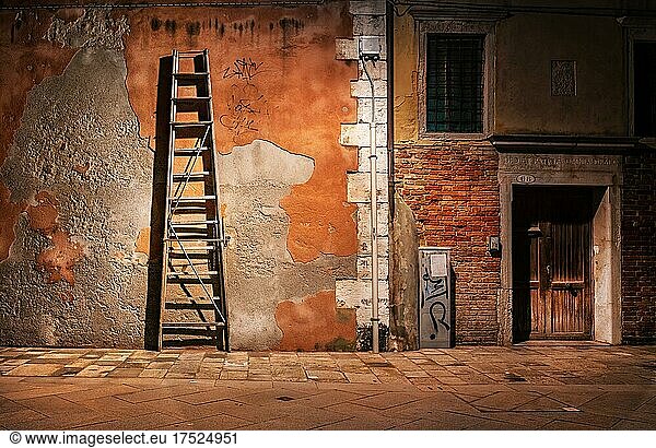 House wall with wooden rung ladder  Venice  Italy  Europe