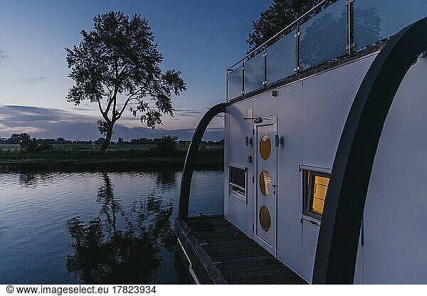Houseboat on Yser River at sunset