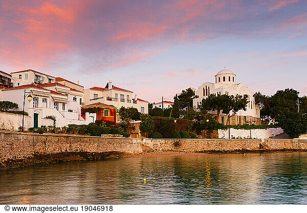 Houses and a church in the harbor of Spetses village  Greece.