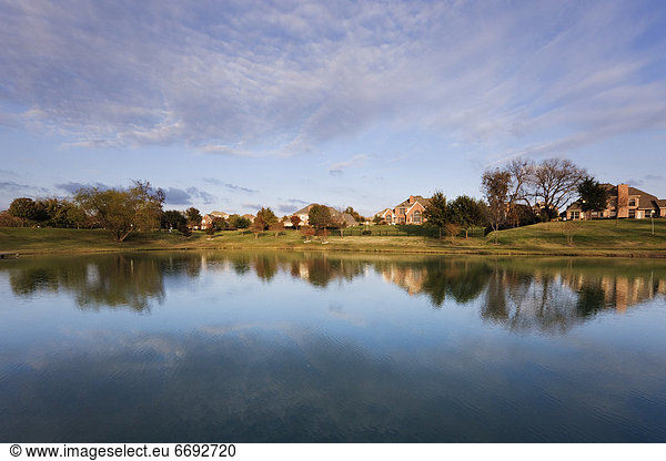 Houses Reflected in Pond