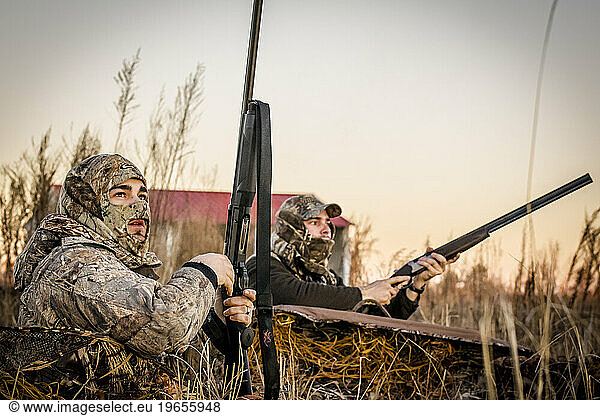Hunters look after a round of ducks