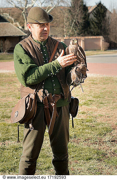 Hunting man with a bird of prey