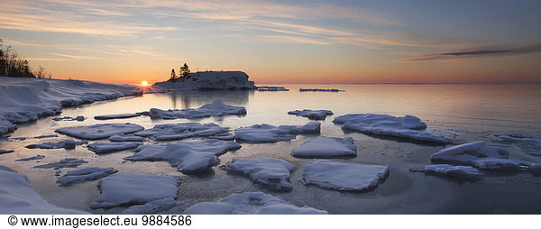 Ice chunks on Lake Superior at sunrise; Grand Portage  Minnesota  United States of America