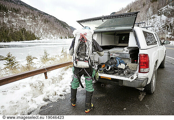 Ice climber preparing to climb in Adirondack Mountains  USA