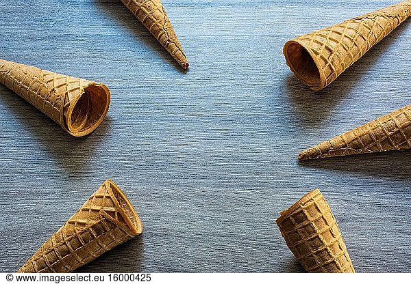 Ice cream cones on a table.