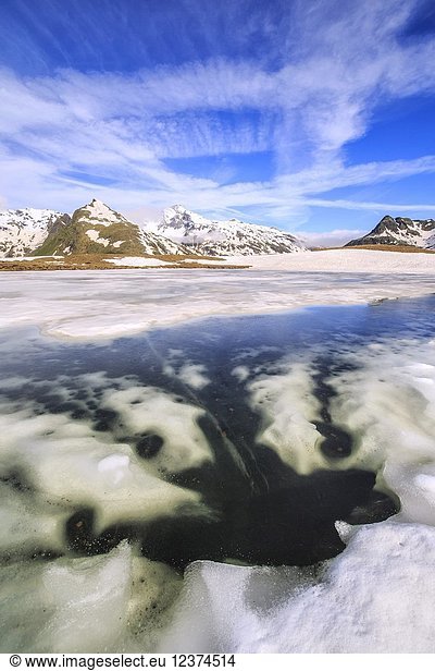 Ice melting at Lake Andossi during spring thaw  Chiavenna Valley  Spluga Valley  Sondrio province  Valtellina  Lombardy  Italy.