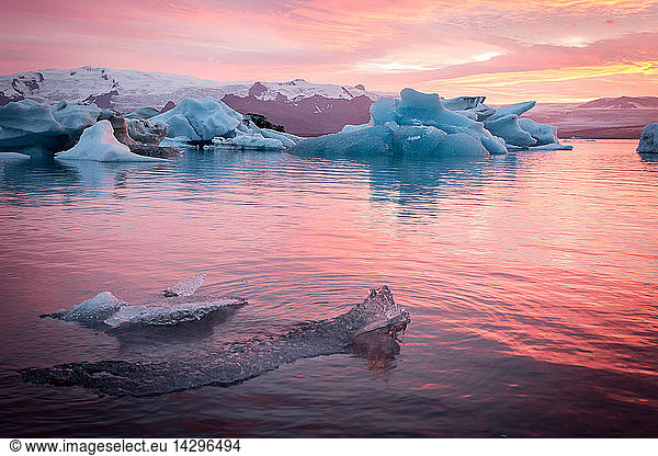 Icebergs and ice chunk at sunset  South Iceland  Iceland  Polar Regions

